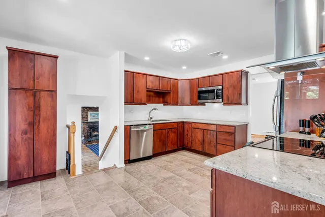 a living room with furniture a flat screen tv and a table