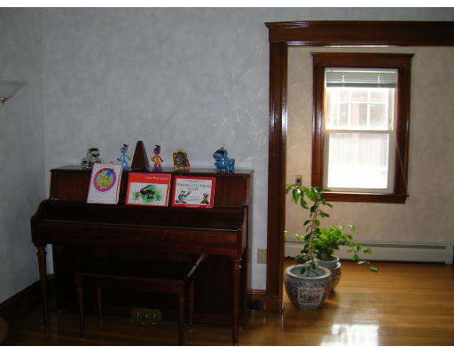4 Margaret Road Newton, MA 02461 - Photo 3 of 10 a room with furniture and a potted plant