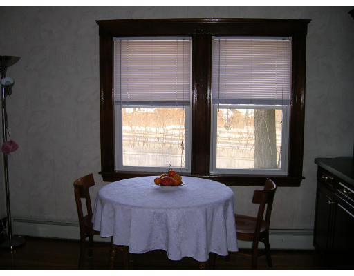 4 Margaret Road Newton, MA 02461 - Photo 6 of 10 a bedroom with a bed and a window