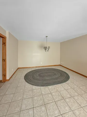 a view of a room with a wooden floor and cabinet