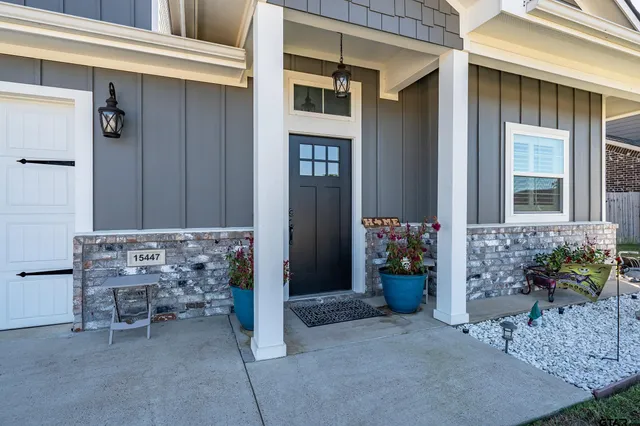 a front view of a house with outdoor seating