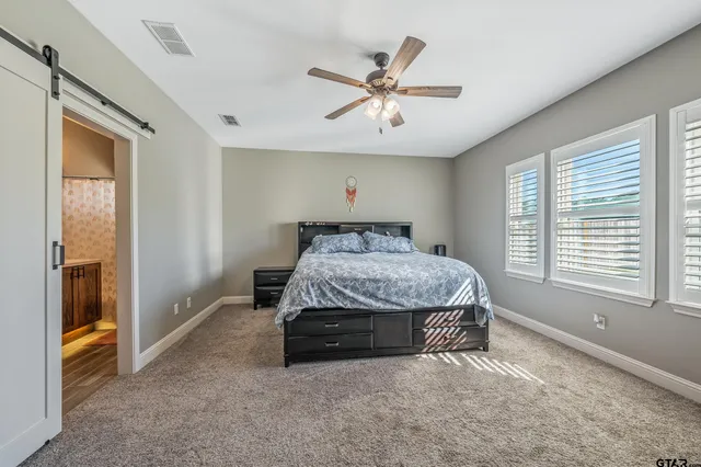 a bed sitting in a room next to a window