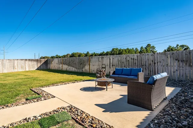 a view of swimming pool with patio