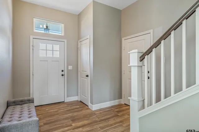 a view of an entryway with wooden floor