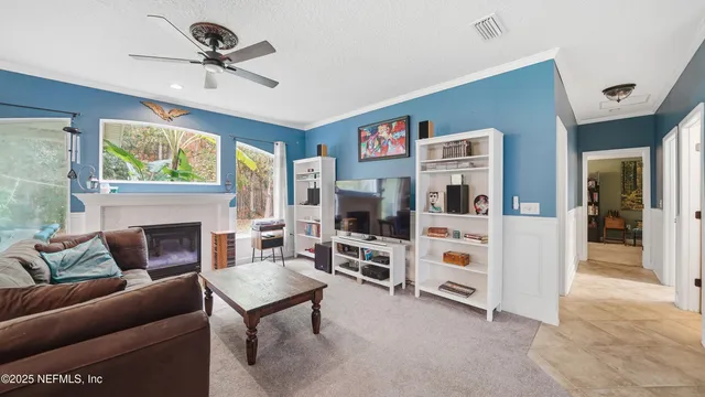 a kitchen with stainless steel appliances a stove a sink and a microwave