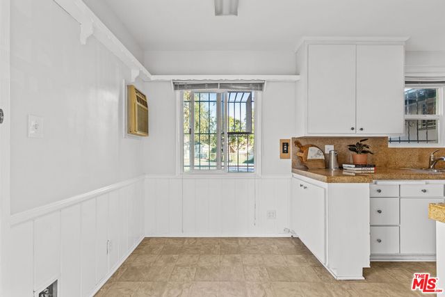 a kitchen with granite countertop a sink and a window