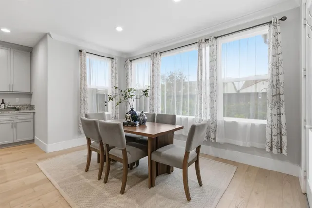 a living room with furniture and painting on the wall