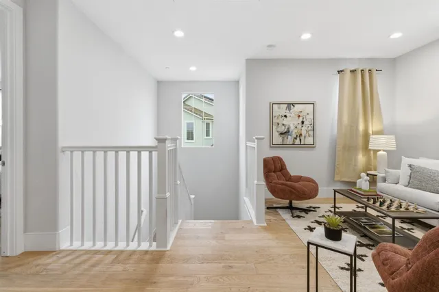 a view of a kitchen with a refrigerator and a sink