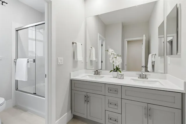 a spacious bedroom with a large bed and a large window