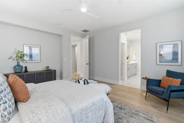 a spacious bathroom with a granite countertop sink and a mirror