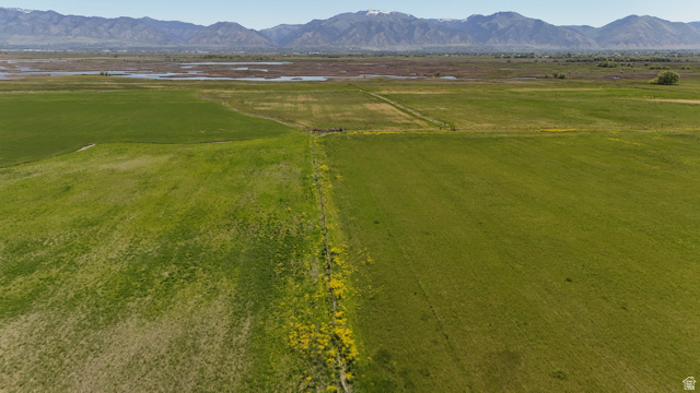 320 South 5400 West Logan, UT 84321 - Photo 21 of 42 Expansive green fields with distant mountains and water features