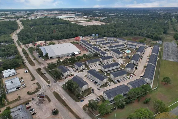 an aerial view of a building with lots of residential buildings