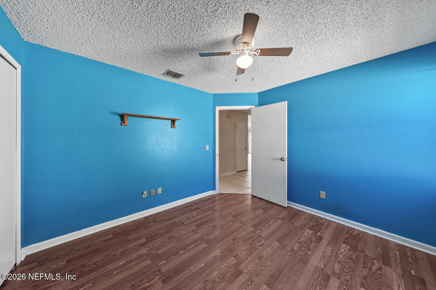 494 Filmore Drive Jacksonville, FL 32225 - Photo 18 of 25 a view of an empty room with a chandelier fan
