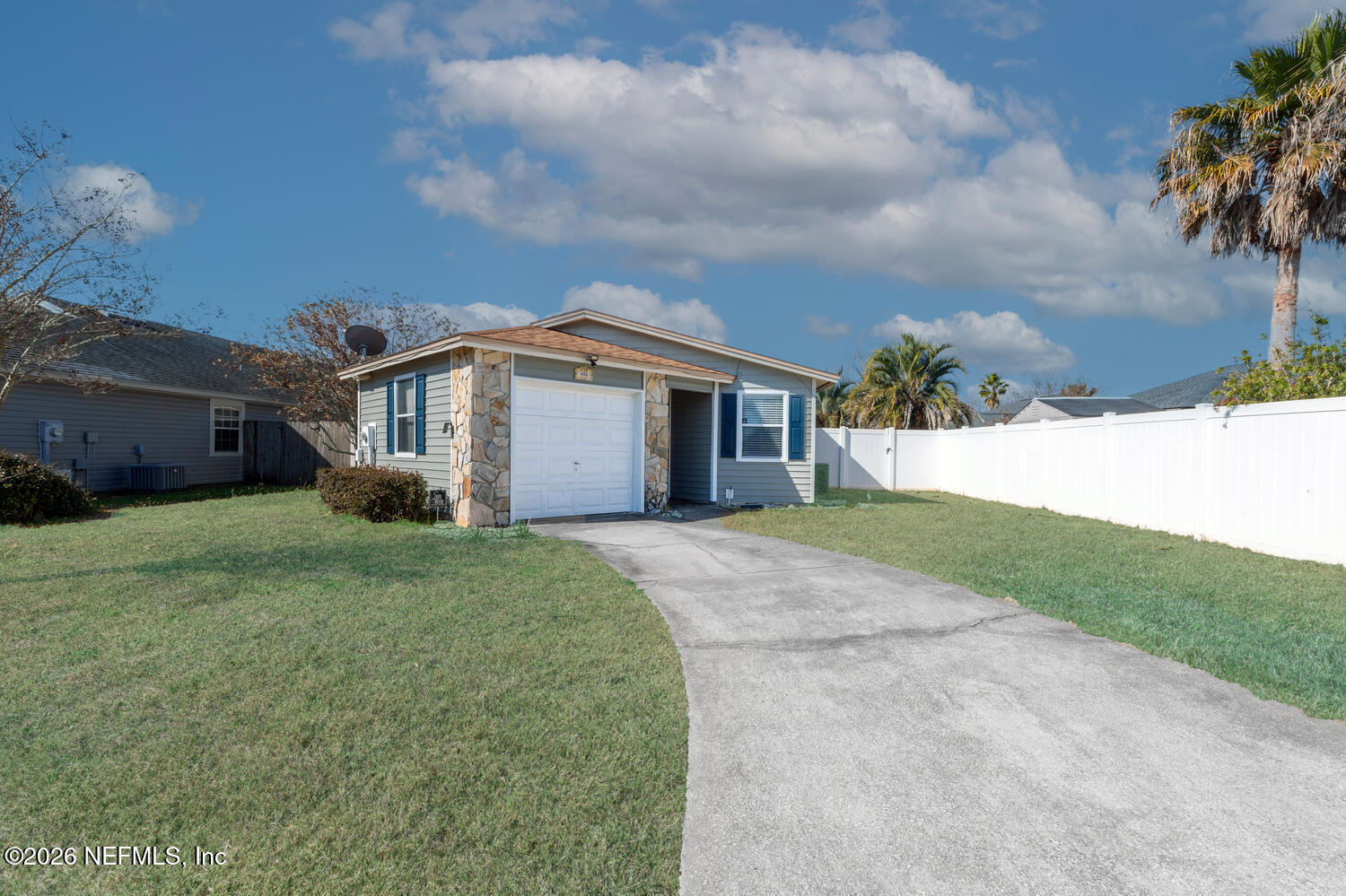 494 Filmore Drive Jacksonville, FL 32225 - Photo 2 of 25 a front view of a house with a yard and garage