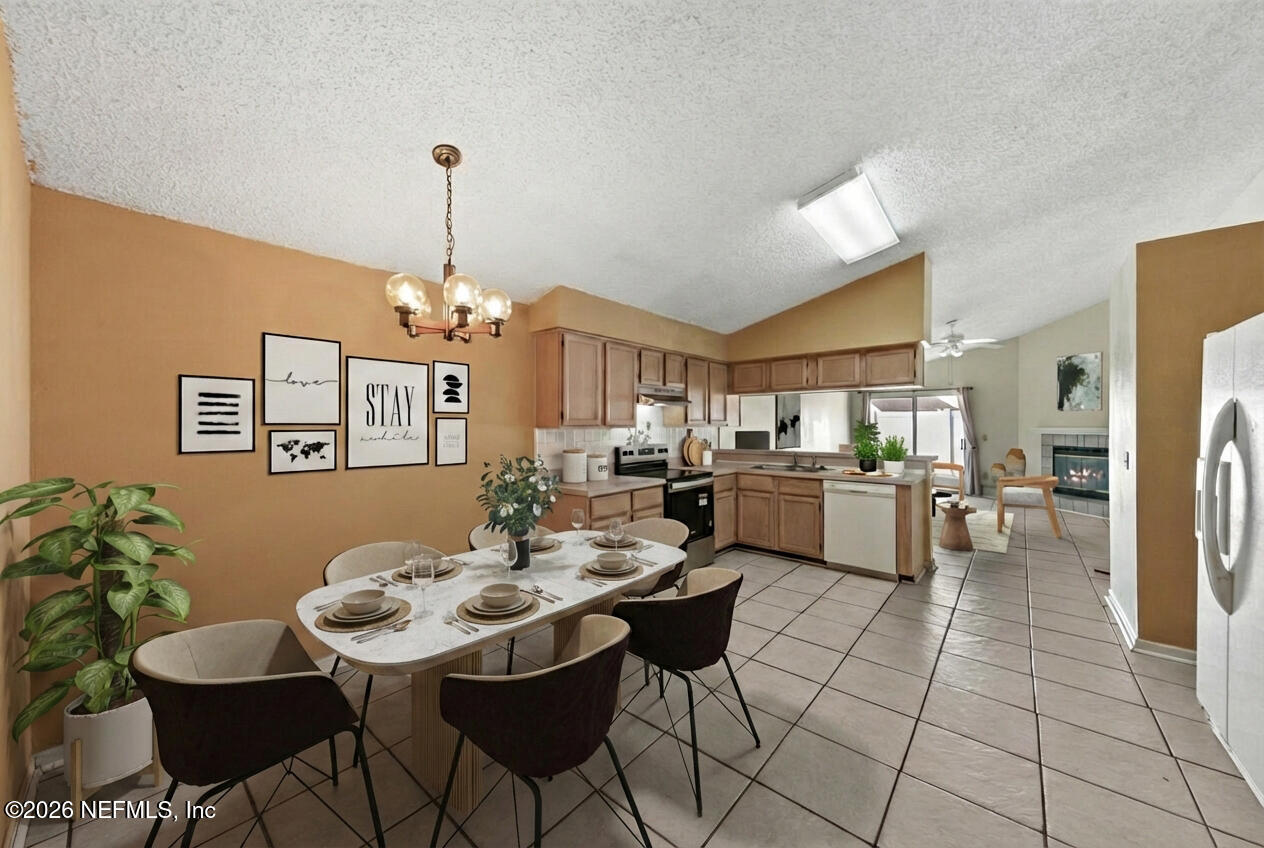 494 Filmore Drive Jacksonville, FL 32225 - Photo 6 of 25 a view of a dining room kitchen and a chandelier