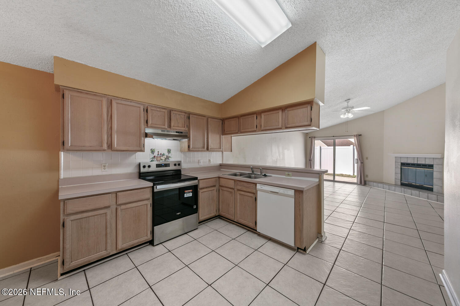 494 Filmore Drive Jacksonville, FL 32225 - Photo 7 of 25 a kitchen with a stove top oven sink and cabinets