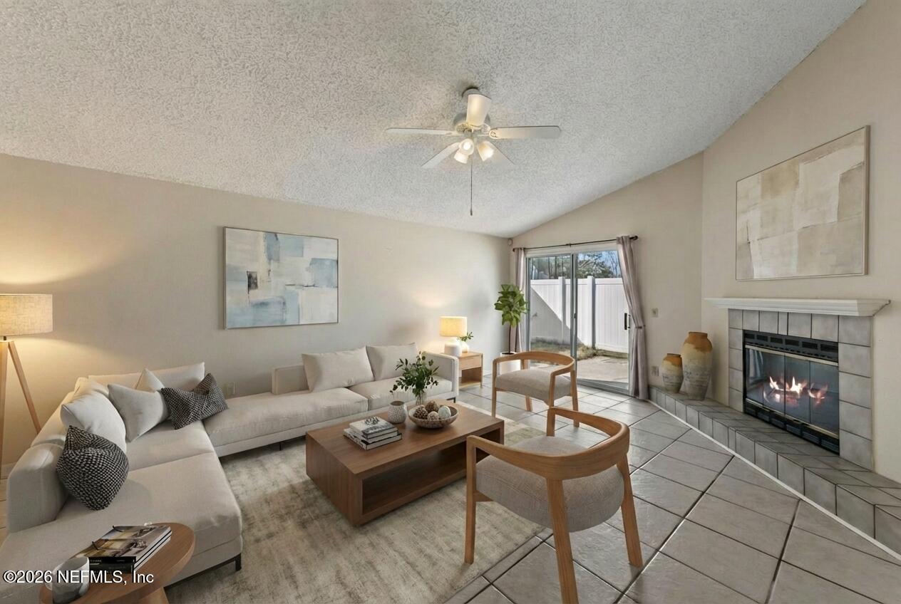 494 Filmore Drive Jacksonville, FL 32225 - Photo 10 of 25 a living room with furniture and a fireplace