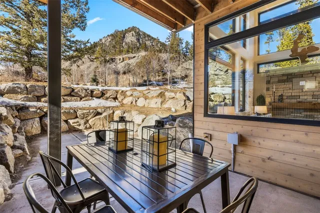 a view of balcony with a dining table and chairs