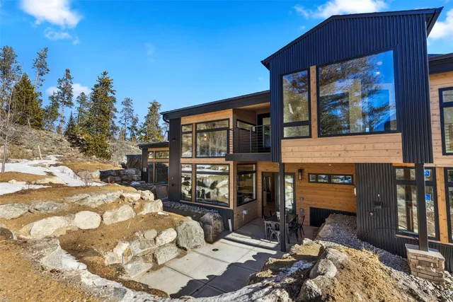 a view of a patio with table and chairs and potted plants