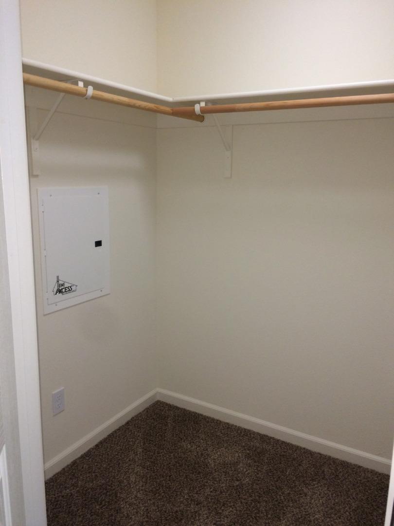 695 Elderberry Drive Milpitas, CA 95035 - Photo 15 of 22 a view of a room with racks on the wall