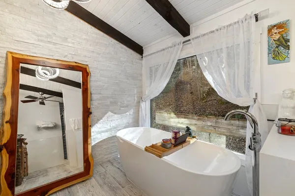 a bathroom with a sink and mirror