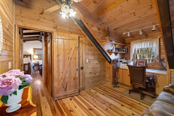 a view of entryway with wooden floor and furniture