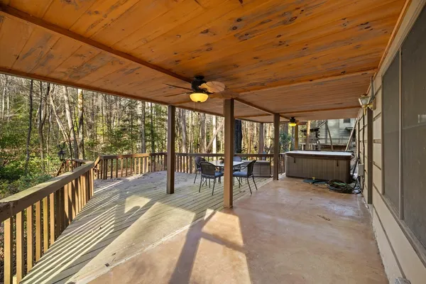 a view of a porch with wooden floor and outdoor space