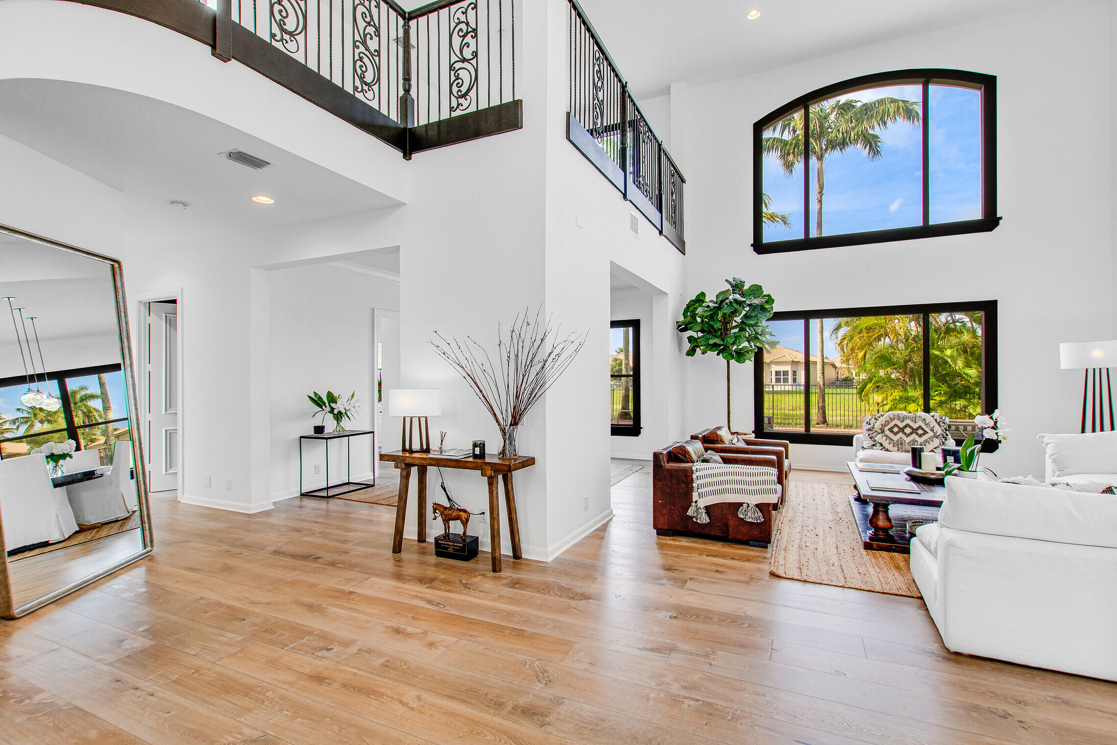 11663 Sunrise View Lane Wellington, FL 33449 - Photo 11 of 43 a living room with furniture and a wooden floor