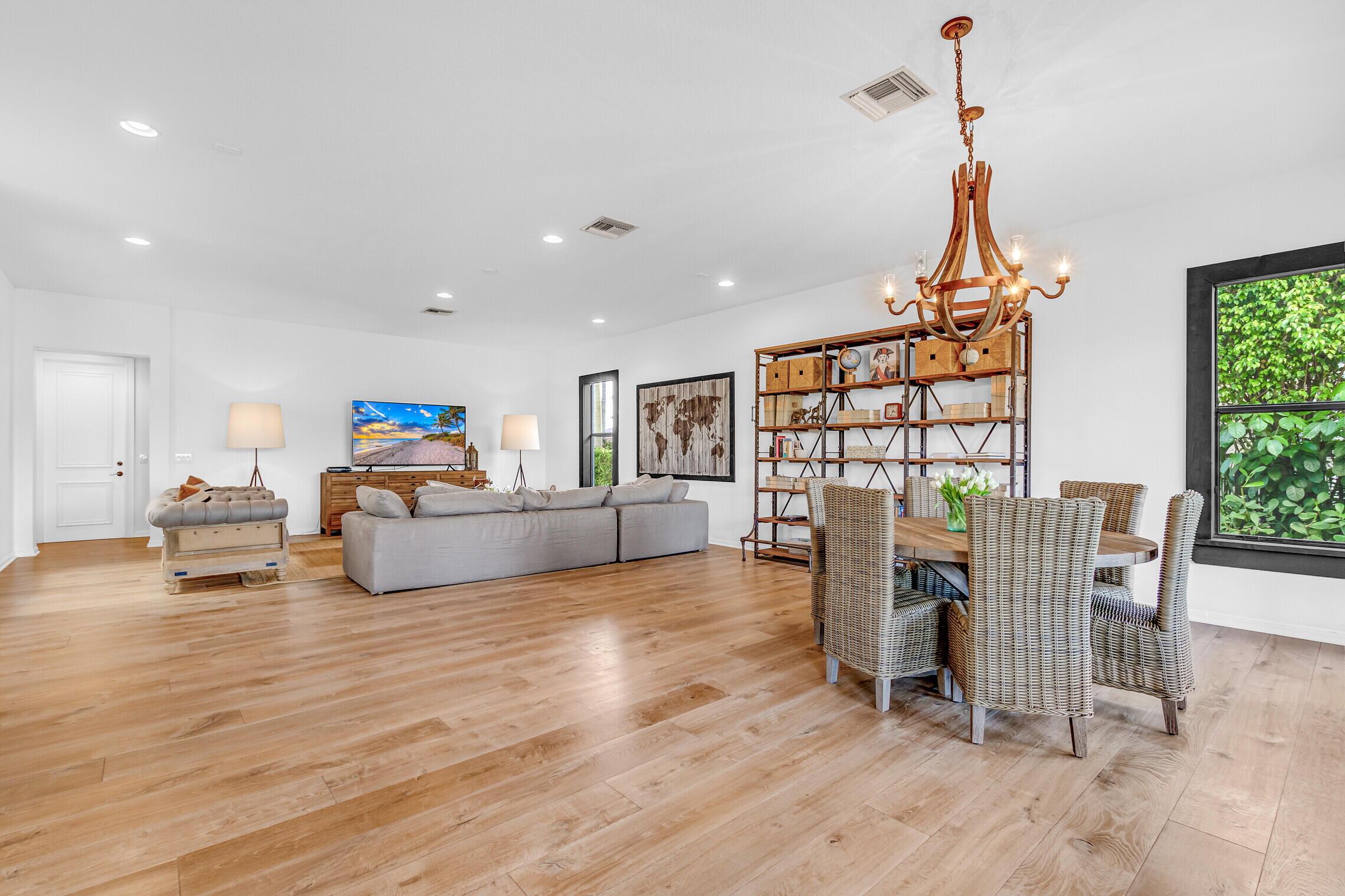 11663 Sunrise View Lane Wellington, FL 33449 - Photo 12 of 43 a living room with furniture a couch and a floor to ceiling window