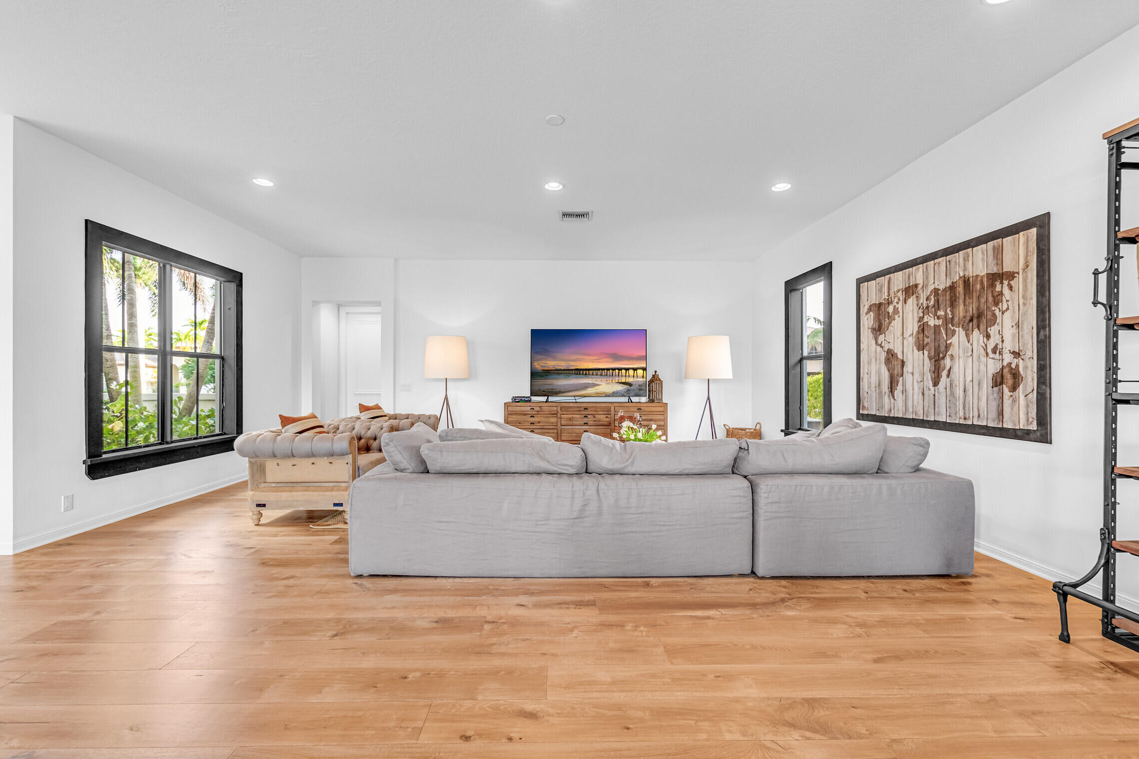 11663 Sunrise View Lane Wellington, FL 33449 - Photo 14 of 43 a living room with furniture and a flat screen tv