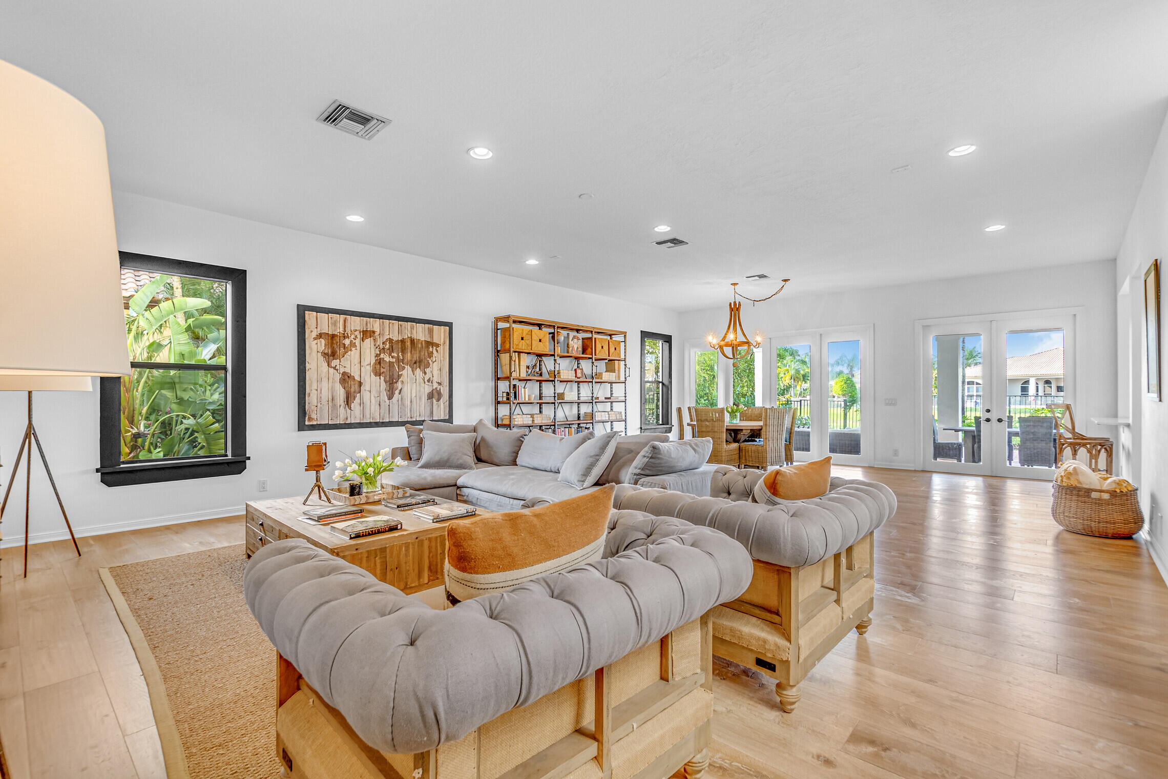 11663 Sunrise View Lane Wellington, FL 33449 - Photo 15 of 43 a living room with furniture and a large window