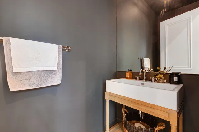 a bathroom with a sink vanity and a mirror