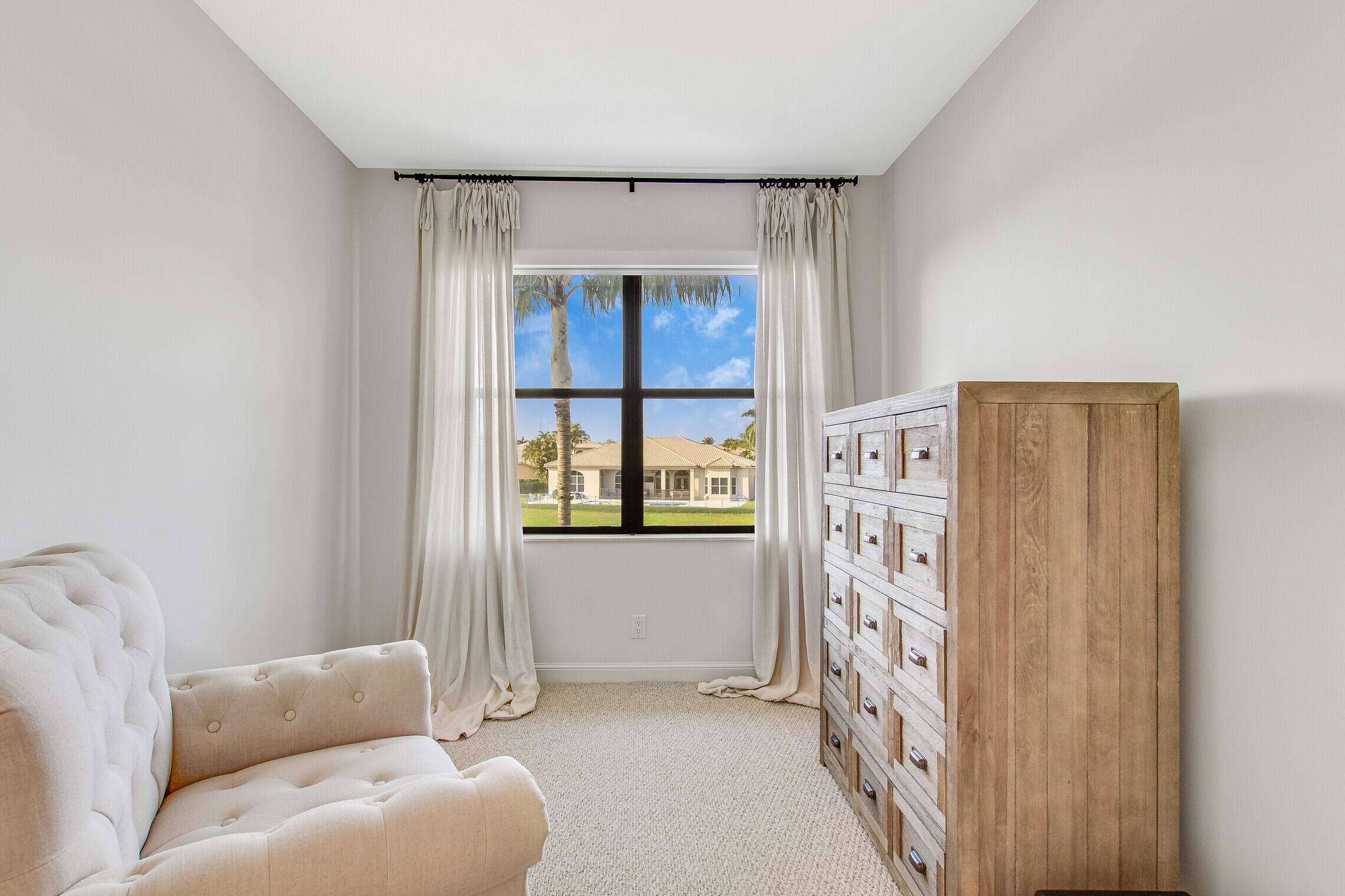 11663 Sunrise View Lane Wellington, FL 33449 - Photo 25 of 43 a living room with furniture and a window
