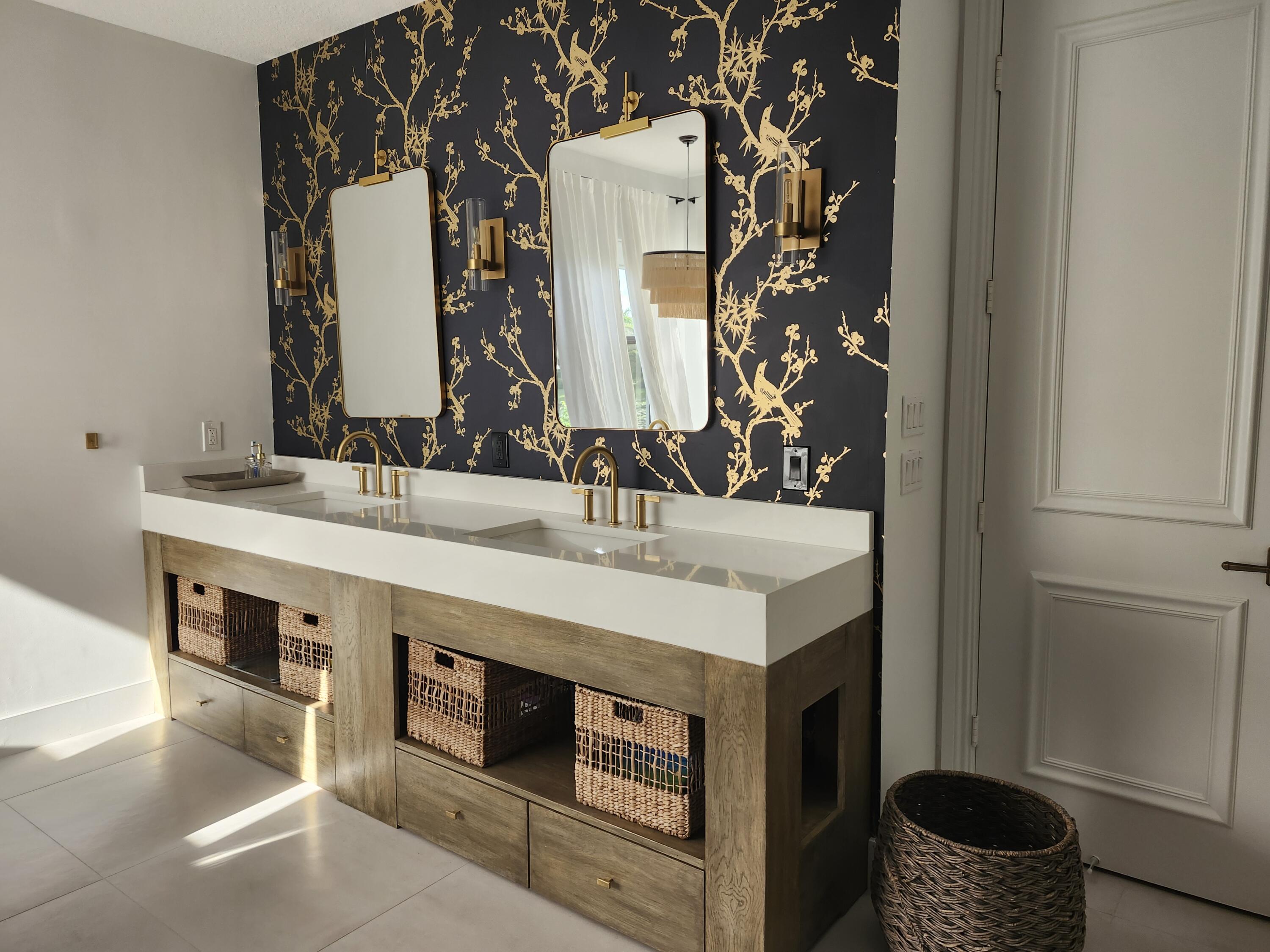 11663 Sunrise View Lane Wellington, FL 33449 - Photo 27 of 43 a bathroom with a sink and a mirror