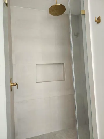 a bedroom with two beds and a window