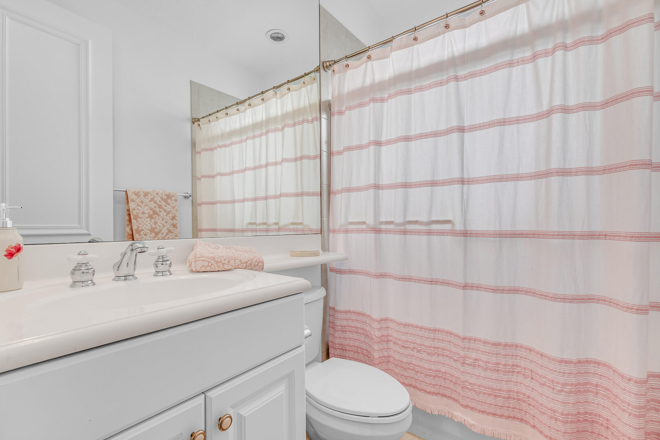 11663 Sunrise View Lane Wellington, FL 33449 - Photo 29 of 43 a bathroom with a sink a toilet and shower