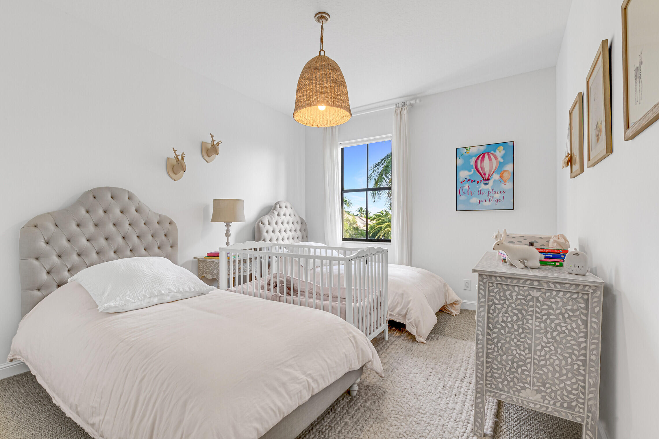 11663 Sunrise View Lane Wellington, FL 33449 - Photo 30 of 43 a bedroom with two beds and a window