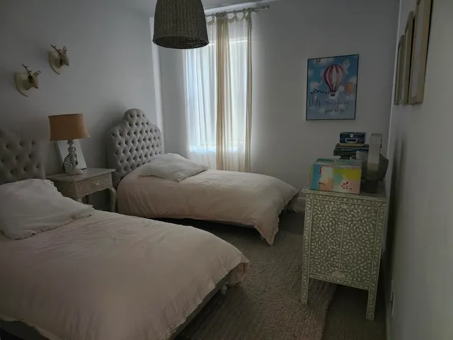 a bedroom with a bed and a chair