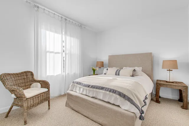 a view of a house with swimming pool and sitting area