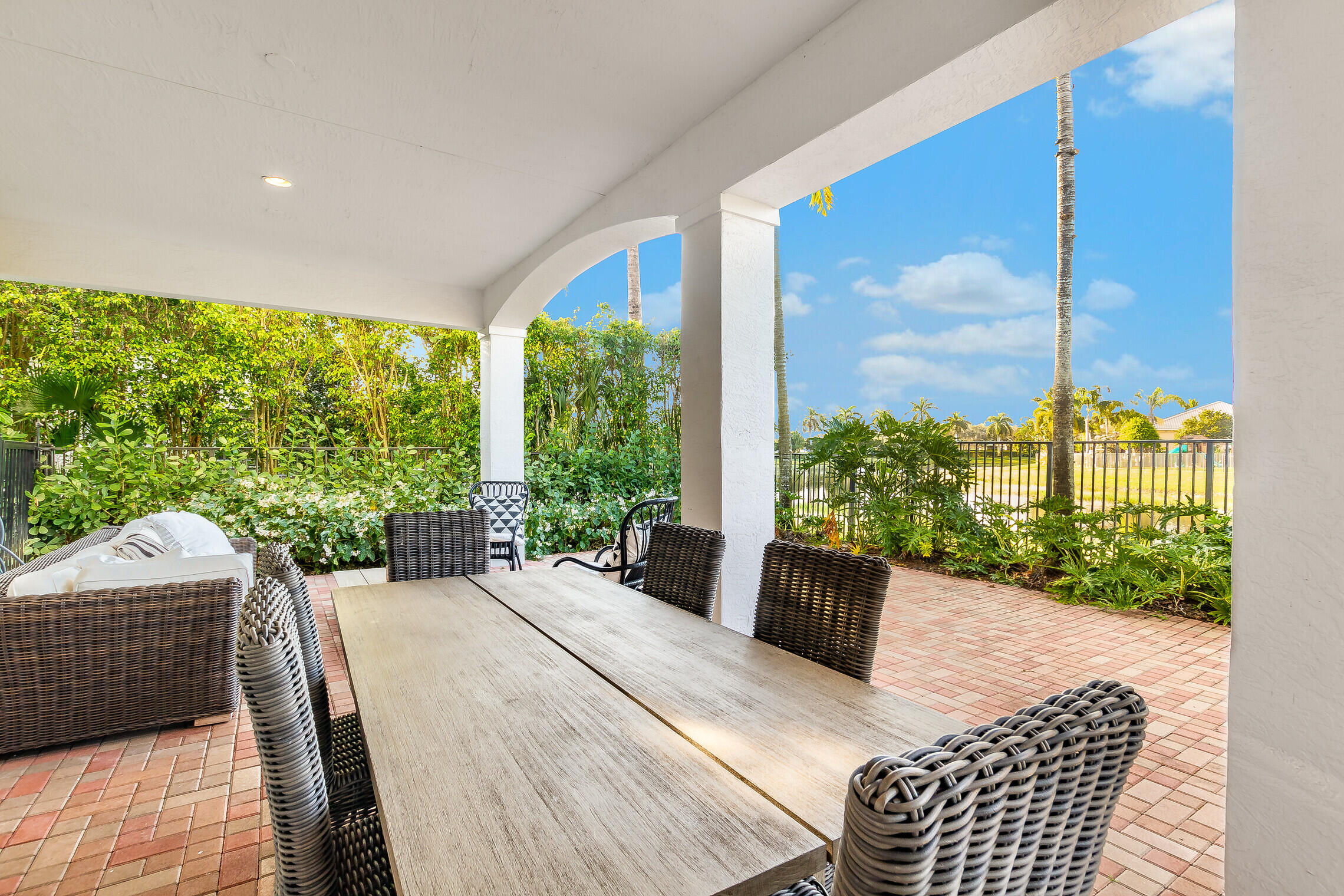 11663 Sunrise View Lane Wellington, FL 33449 - Photo 36 of 43 a balcony with furniture and garden view