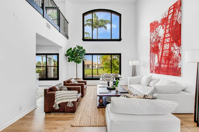 a living room with furniture fireplace and flat screen tv