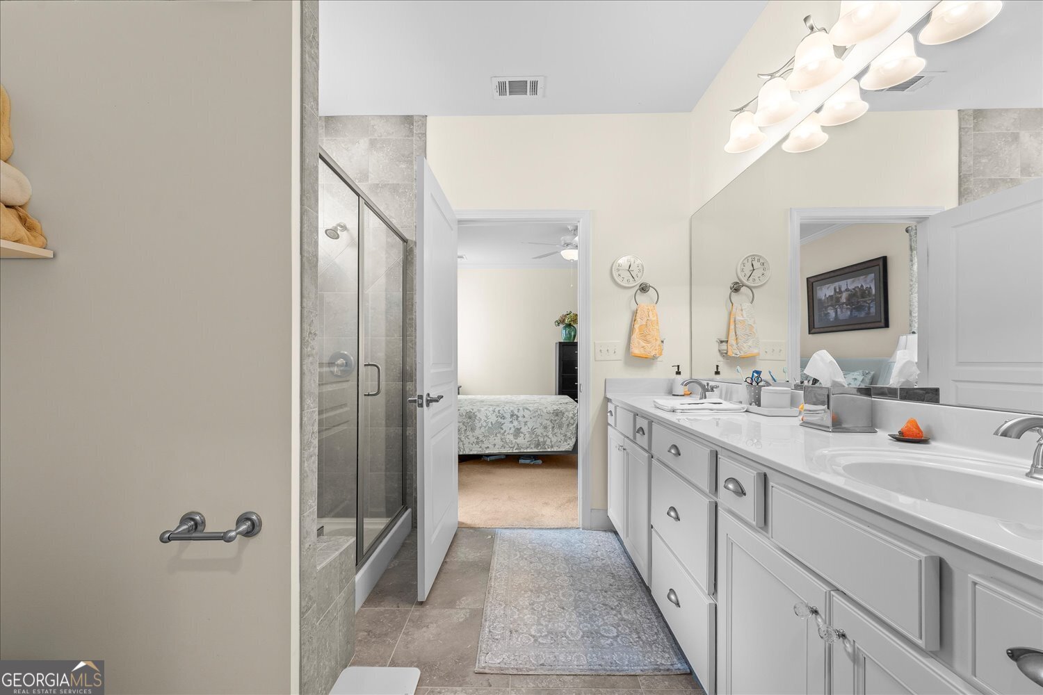 1071 Southern Pne Road Greensboro, GA 30642 - Photo 18 of 48 a en suite spacious bathroom with a double vanity sink mirror and shower