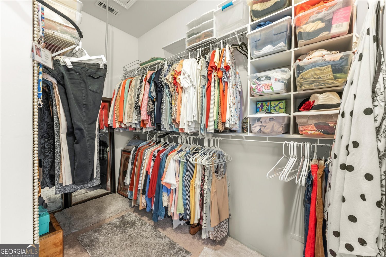 1071 Southern Pne Road Greensboro, GA 30642 - Photo 20 of 48 a view of walk in closet with clothes