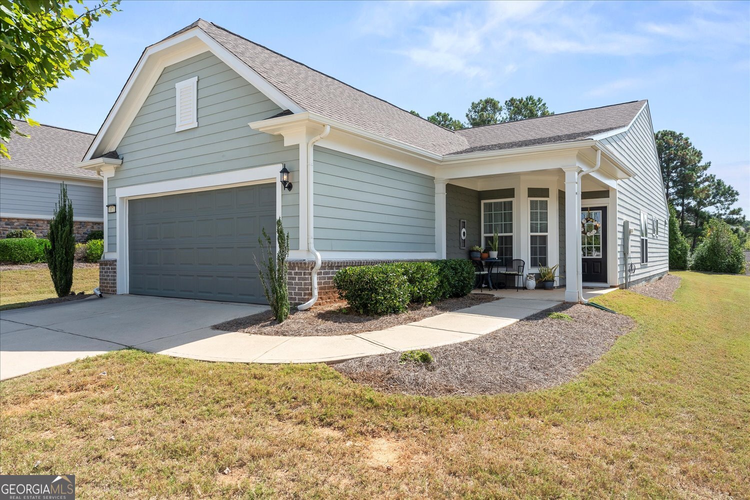 1071 Southern Pne Road Greensboro, GA 30642 - Photo 2 of 48 a view of yellow house with small yard plants and large tree