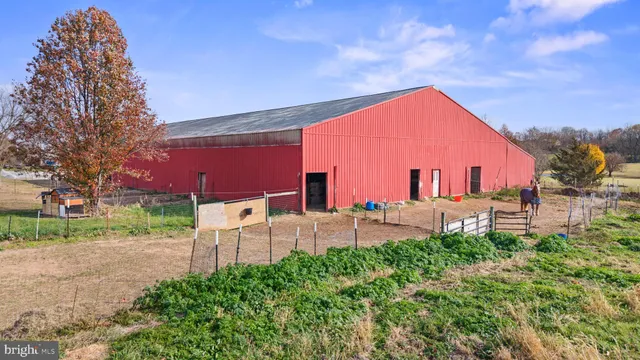 a view of backyard with a garden and outdoor seating