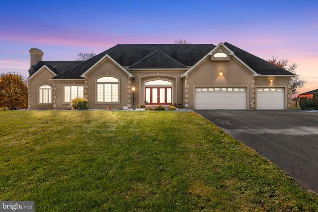 a front view of a house with yard