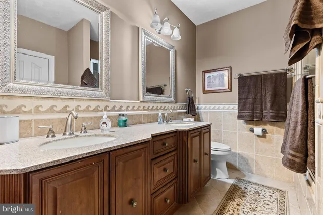 a room that has a bed and a chair in it