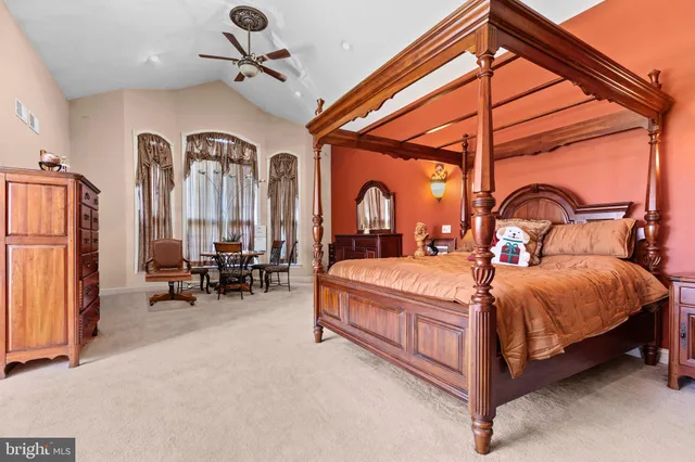 an aerial view of a house with a garden and mountain view