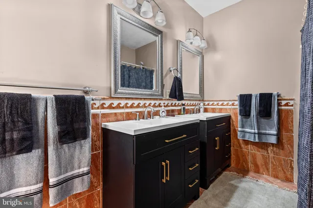 an aerial view of a house with a garden and houses