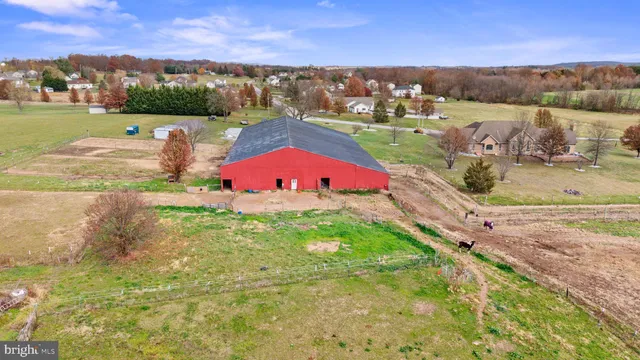 an aerial view of a house with a lake view